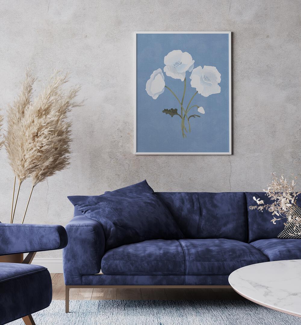 White On Blue By Goed Blauw Botanical Art Prints in White Plain Frame placed on a Grey Colored Wall  near a Blue Sofa in the Living Room