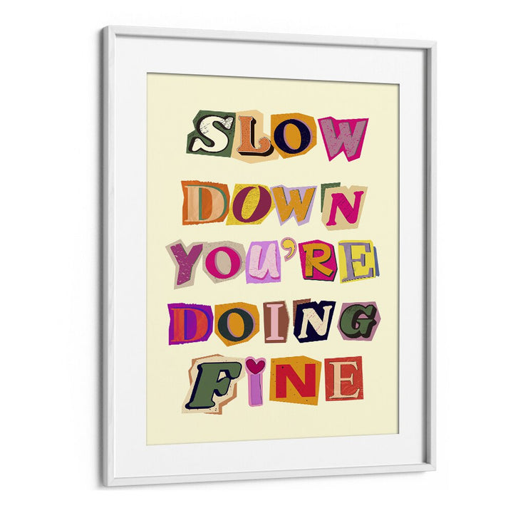 Colorful framed artwork with the quote "SLOW DOWN YOU'RE DOING FINE," perfect for home or office decor.