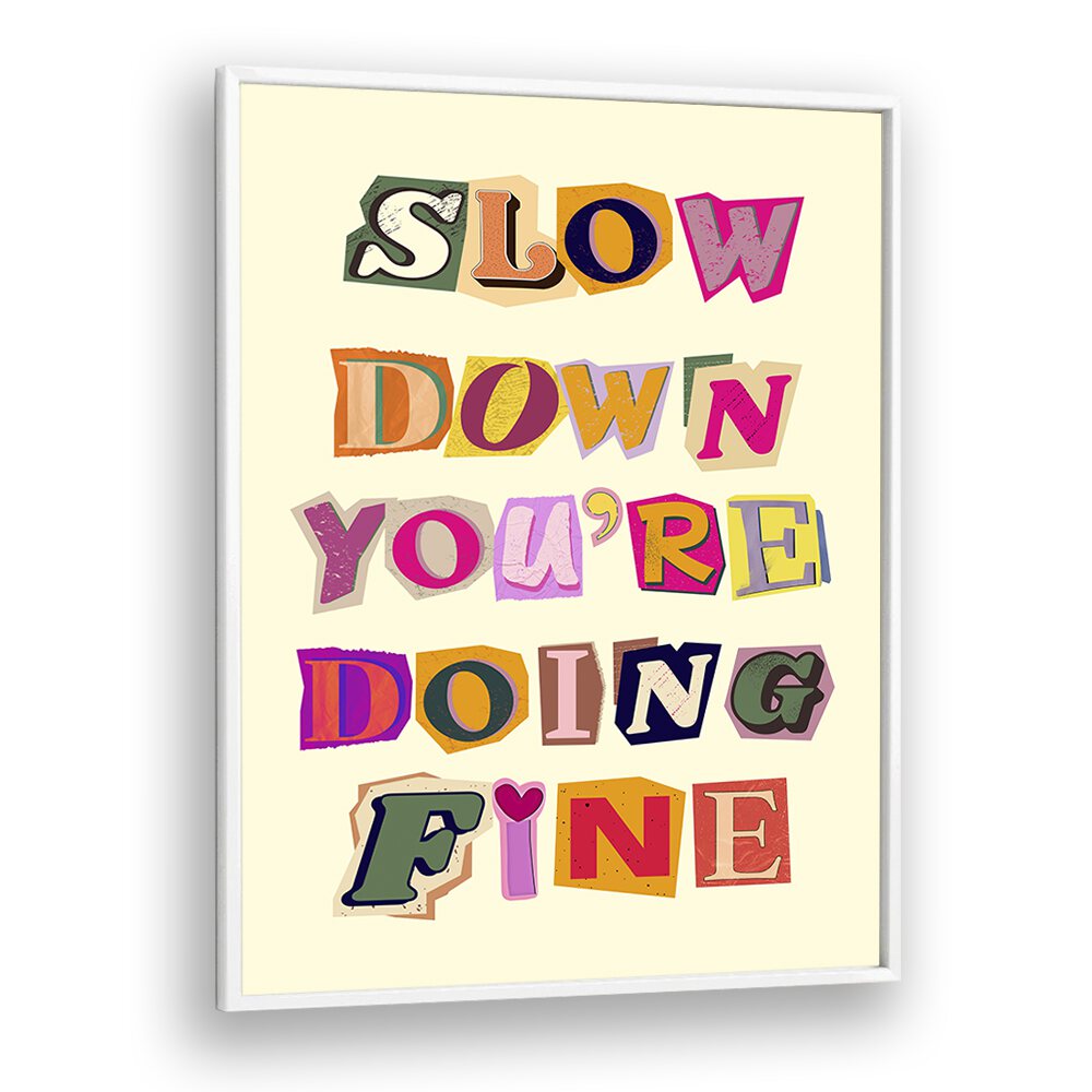 Colorful framed wall art featuring the phrase "SLOW DOWN YOU'RE DOING FINE," perfect for any inspirational decor.
