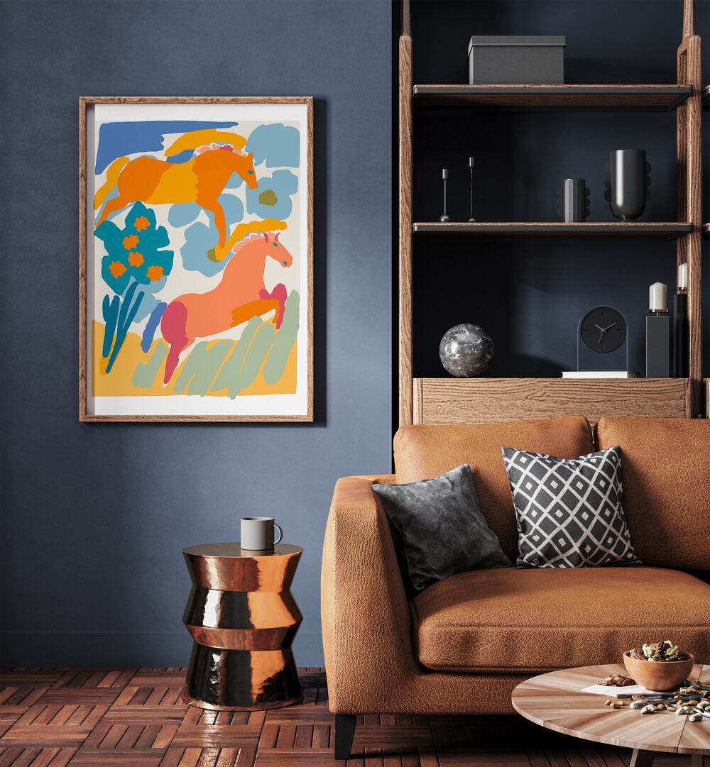 Wild Horses By Treechild Kids Room Art in Oak Wood Plain Frame placed on a Blue Colored Wall near a Brown Sofa in the Living Room