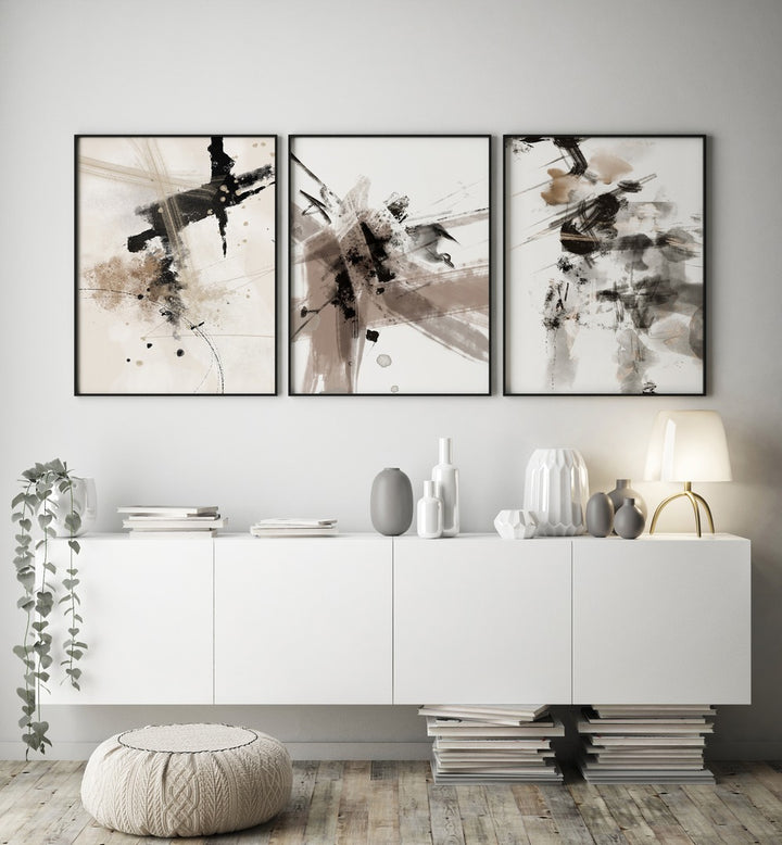 Wild Words Set Set Of 3 Paintings in Black Plain Frame placed on a white wall behind a white console table