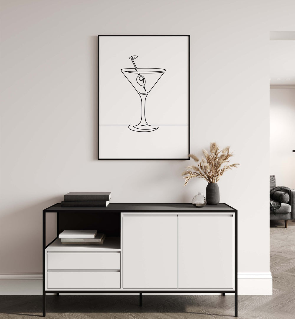 Wine Glass Cafe Art Prints Cafe Posters in Black Plain Frame placed on a wall behind a back and white table