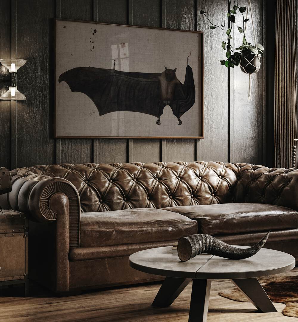 Winged Shadows Gothic Wall Art Prints in Oak Wood Plain Frame hanging on a wall above leather couch beside a window