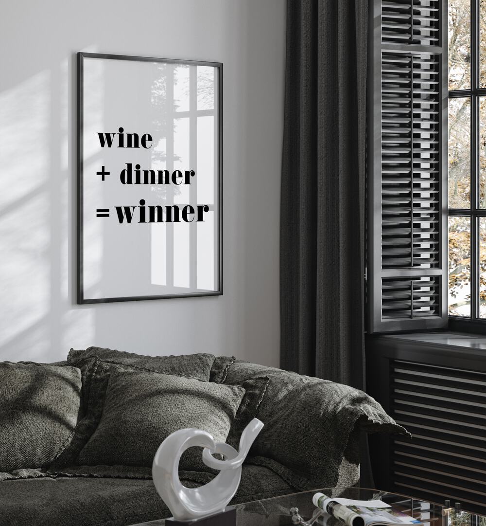 Winner By 1 X Studio Quotes And Typography Posters in Black Plain Frame placed on a White Colored Wall near a Dark Grey Sofa in the Living Room 