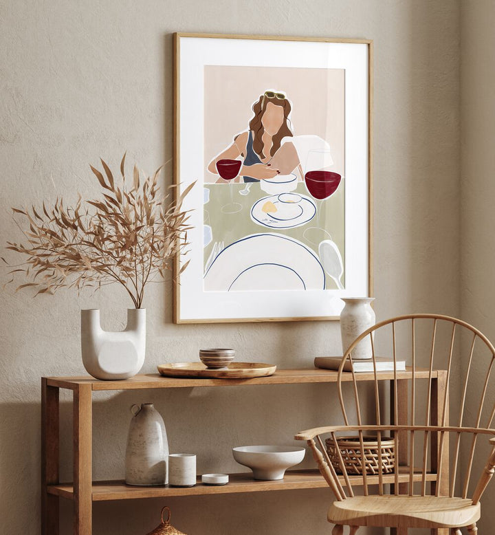 Woman Dining In A Restaurant By Ivy Green Women Illustration Paintings in Oak Wood Frame With Mount on a beige wall above a table