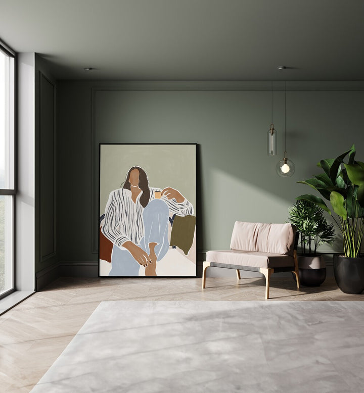 Woman Enjoying a Cup of Espresso By Ivy Green Women Illustration Paintings in Black Plain Frame on a floor beside a sofa