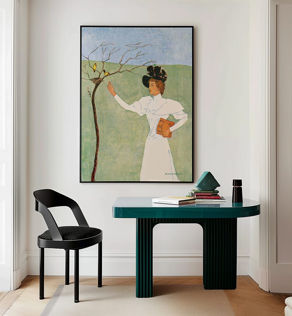 Woman Reaching For Birds 1894 Vintage Paintings in Black Plain Frame placed on a wall behind a study table