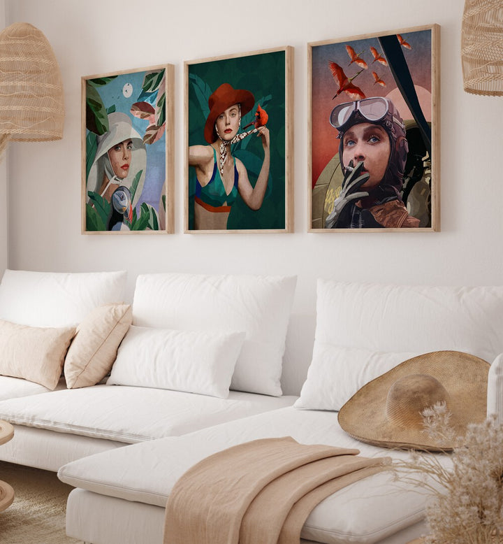 Women Adventure Set Of 3 Paintings in Oak Wood Plain Frame placed on a living room wall behind a sofa