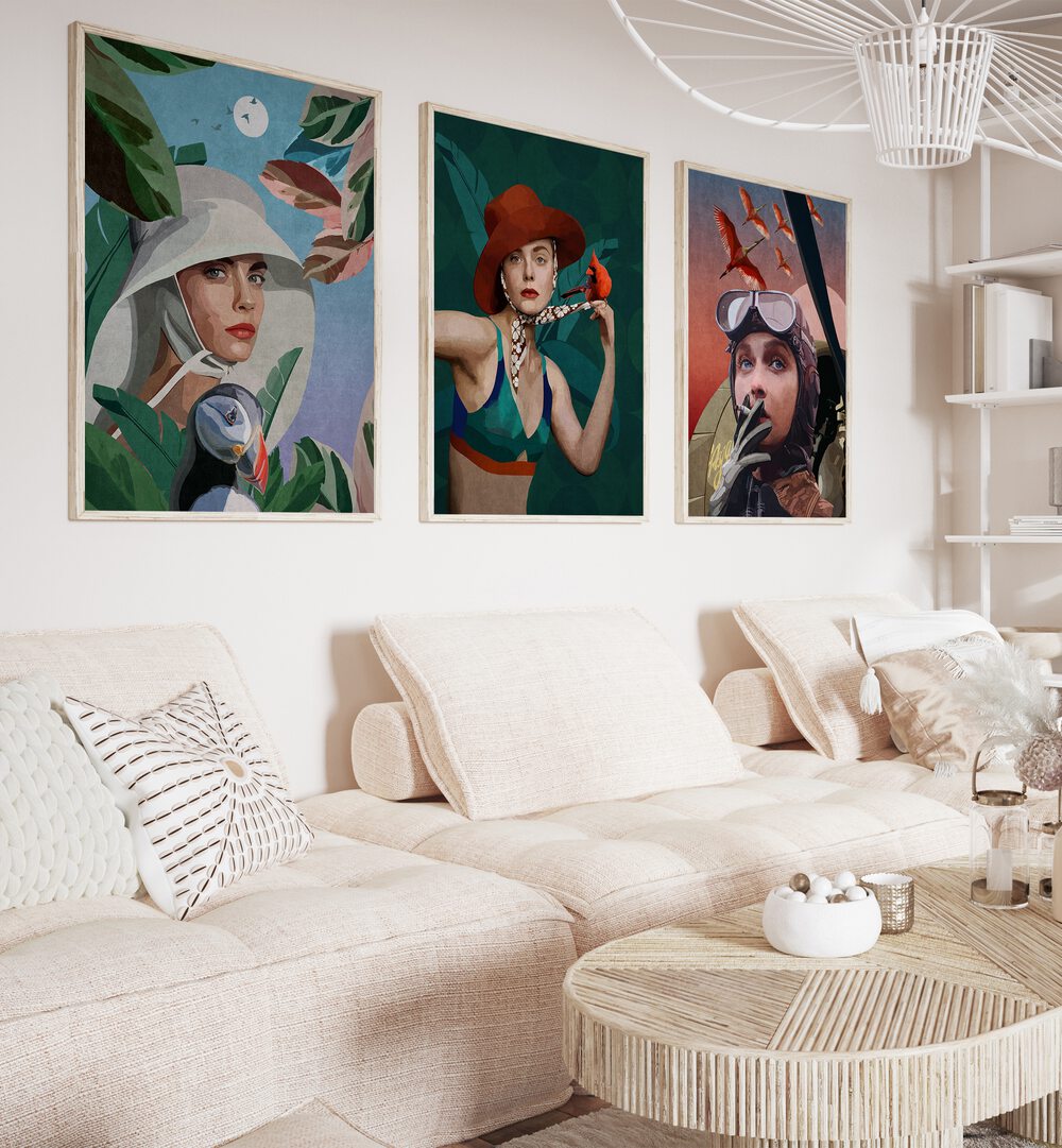 Women Adventure Set Of 3 Paintings in White Plain Frame placed on a living room wall behind a sofa