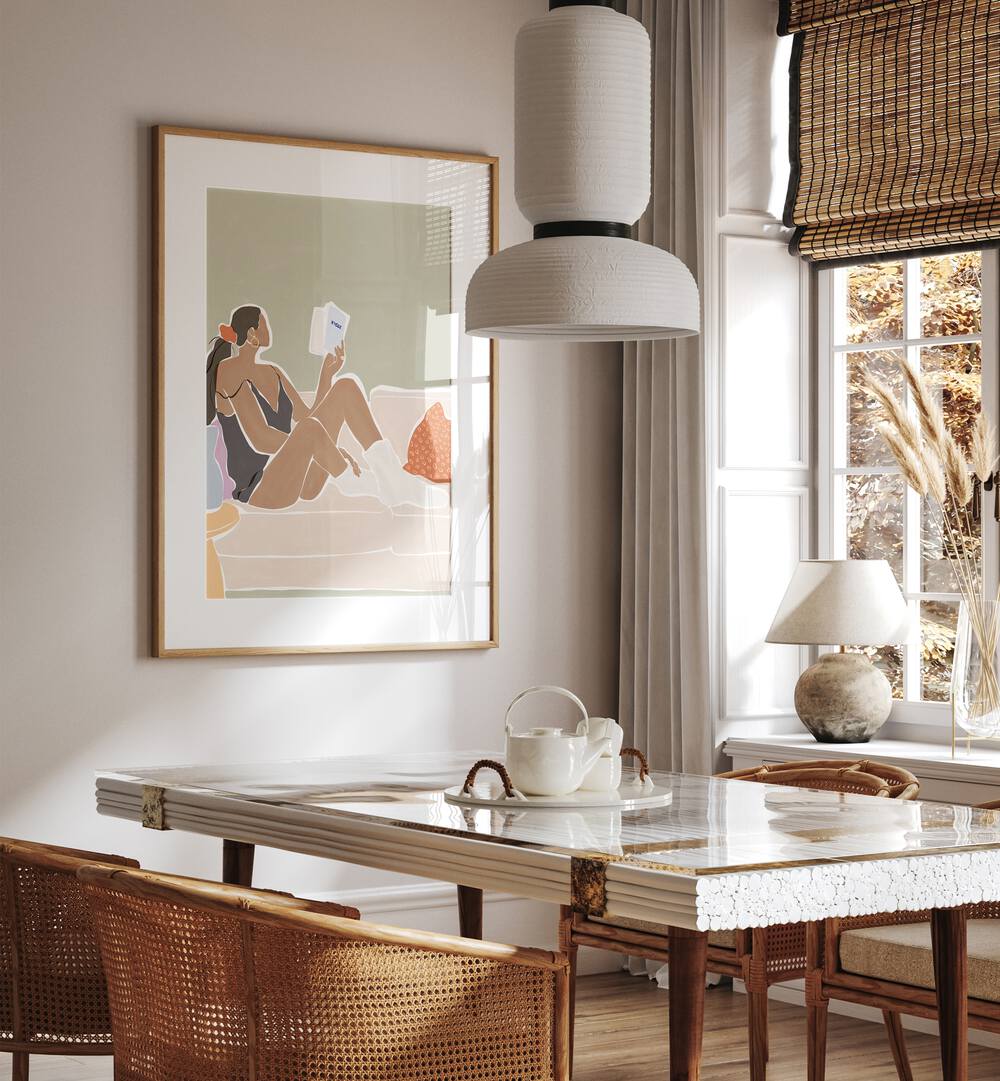 Women Reading a Book By Ivy Green Women Illustration Paintings in Oak Wood Frame With Mount on a white wall behind a dining table for dining area