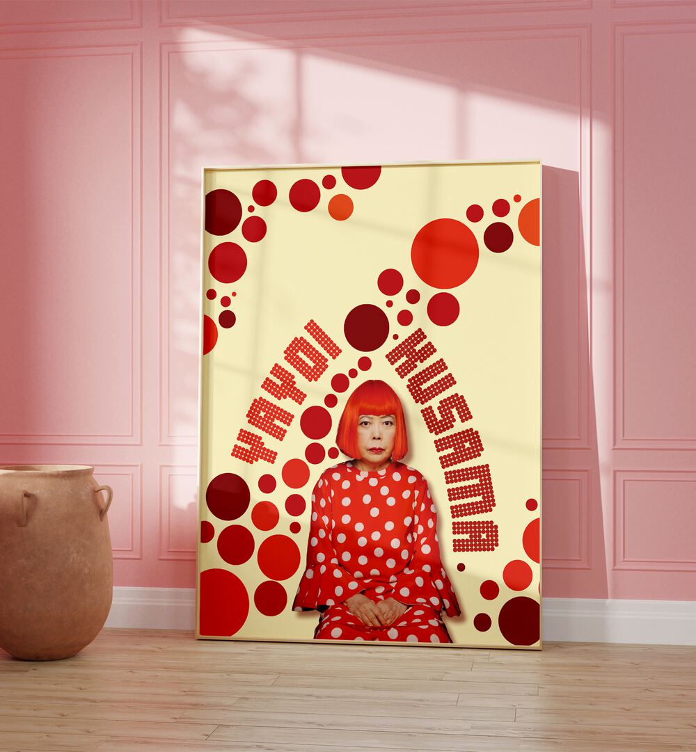 Yayoi Kusama By Grishma Korjani Artist Tribute Posters in Oak Wood Plain Frame placed on a Wooden Floor near a Pink Colored Wall