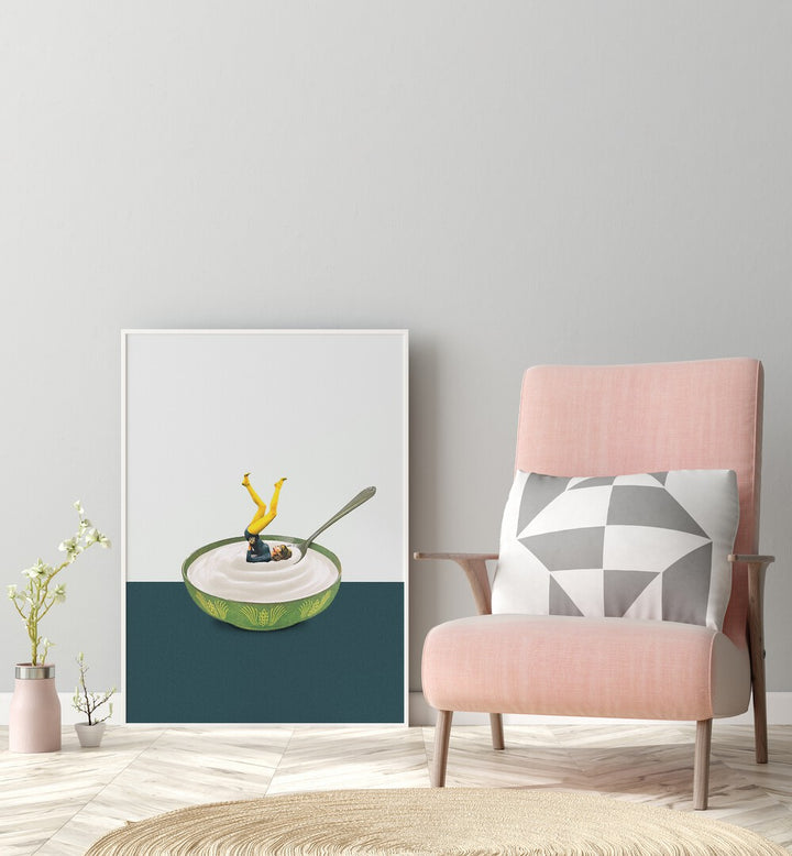 Yoga in My Yogurt by Maarten Leon Bar and Cafe Art in White Plain Frame placed on a floor between a flower pot and a chair