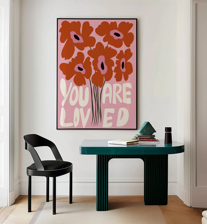 You Are Loved By Miho Art Studio Botanical Art Prints Floral Paintings in Black Plain Frame placed on a Cream Colored Wall near a Table in a Workspace in the Drawing Room