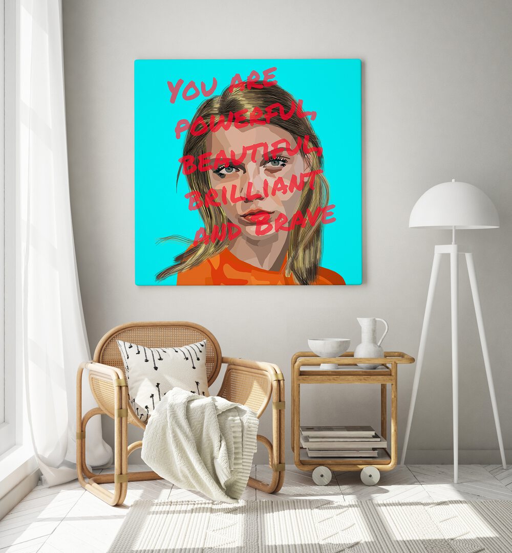 You Are Powerful By Lynnda Rakos Pop Art Paintings Pop Art Prints in Gallery Wrap placed on a wall behind a chair beside a window