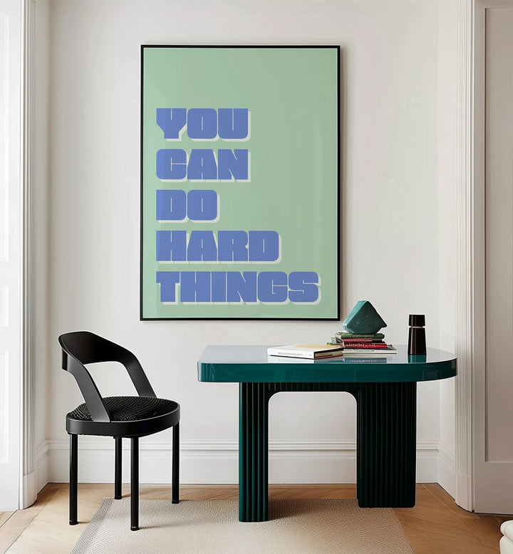 You Can Do Hard Things by Athene Fritsch Quotes and Typography Posters in Black Plain Frame placed on a wall behind a study table