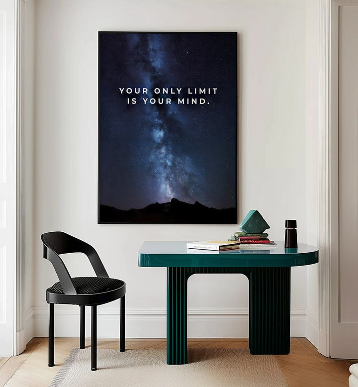 Your Only Limit Is Your Mind Quotes And Typography Posters in Black Plain Frame placed on a Cream Colored Wall near a Study Table in a Workspace in the Drawing Room