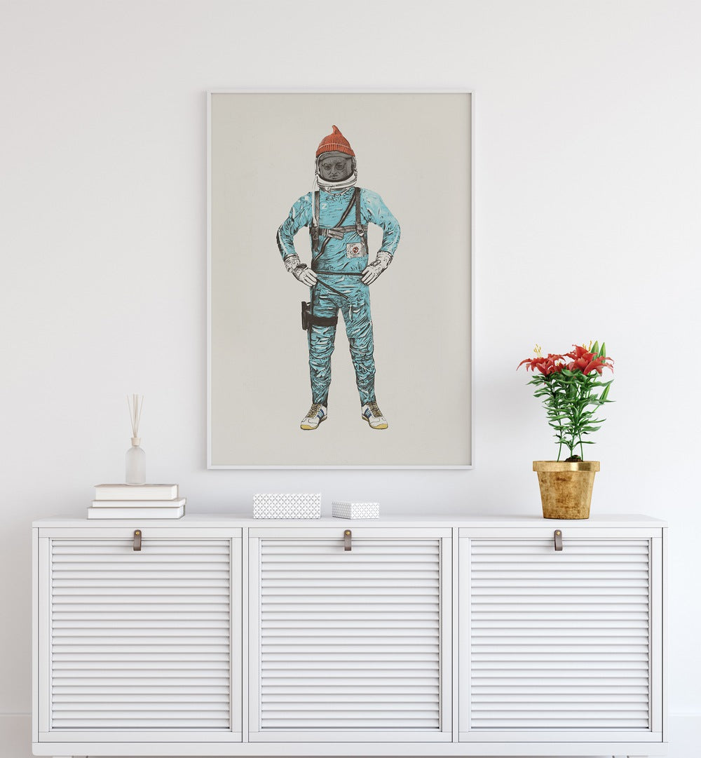 Zissou In Space By Florent Bodart Astronaut & Nasa Paintings, Space Art Prints Artwork in White Plain Frame placed on a White Colored Wall placed above a Console Table

