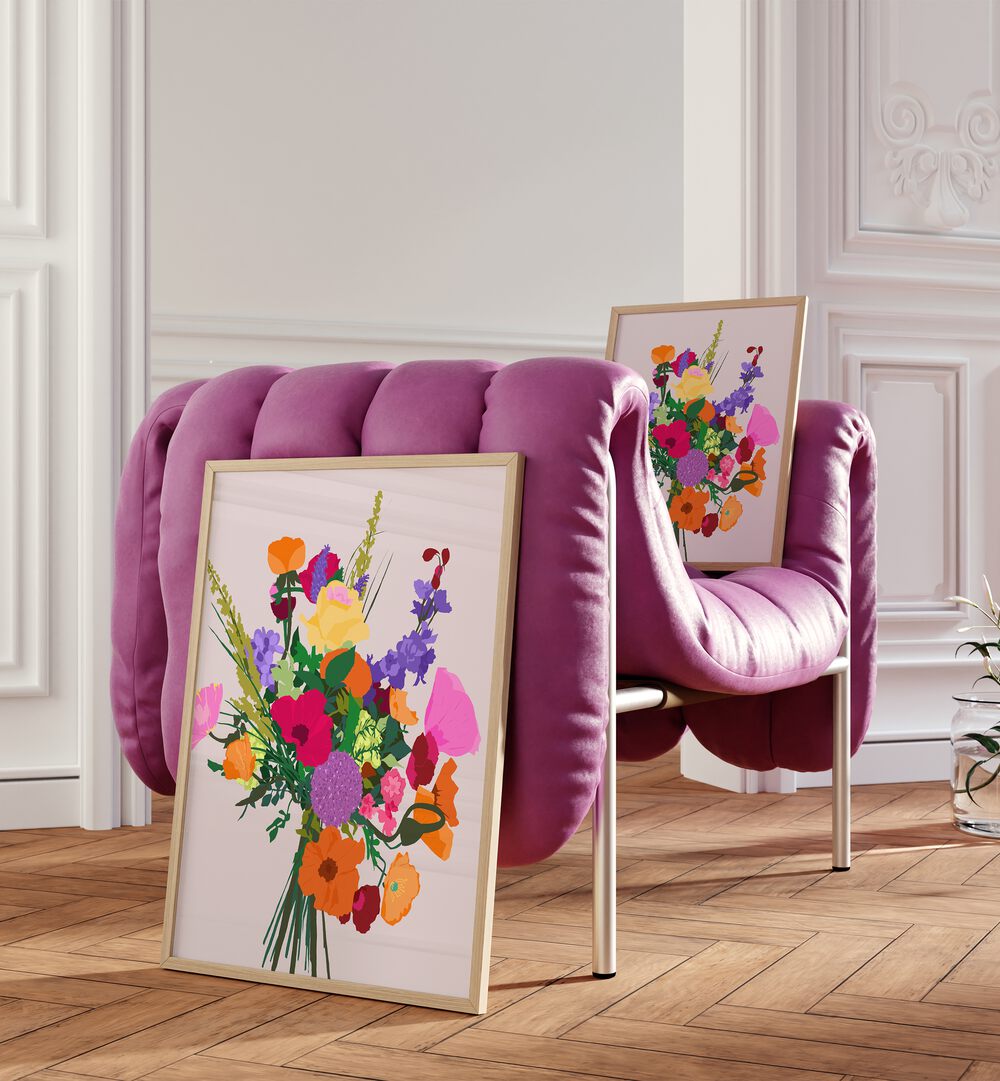 Zeal By Uma Gokhale Botanical Art Prints in White Plain Frame on a wooden floor behind beside a pink sofa and on the sofa