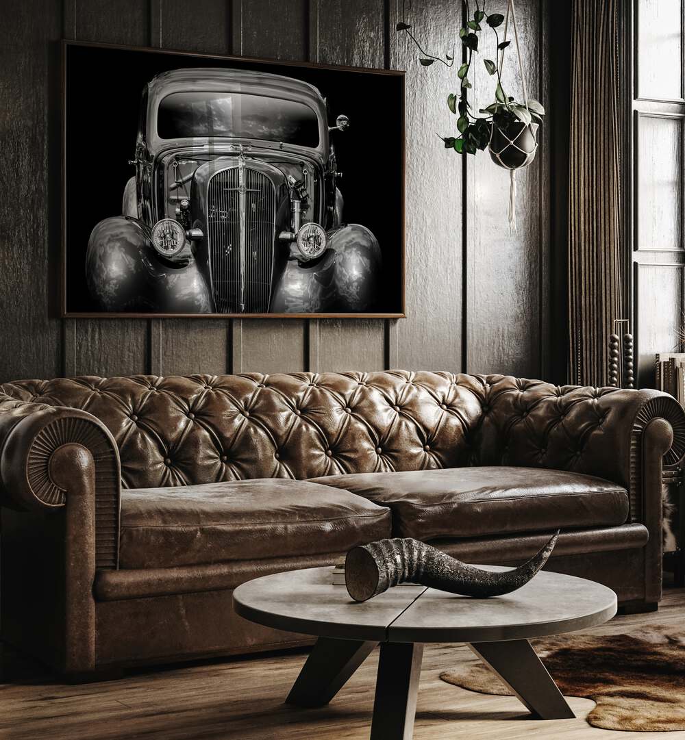 excalibur car poster Artwork  placed on wall near brown sofa