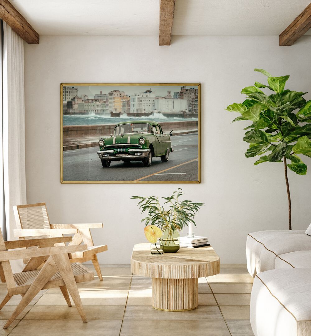 old car car poster Artwork placed on cream colour wall near sofa 