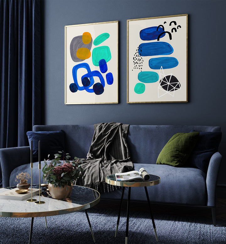 Modern living room with abstract art on the wall, a blue sofa, and decorative items.