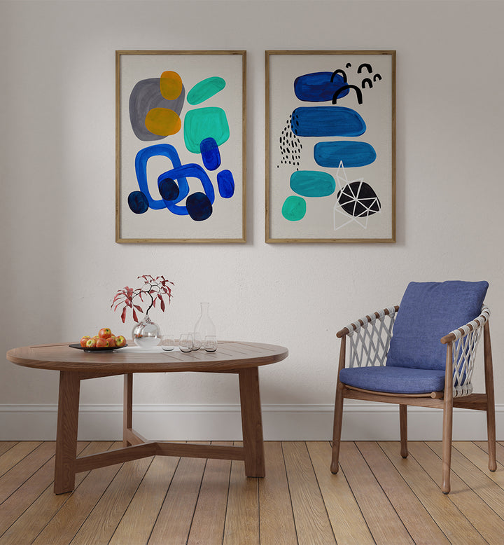 Modern living room with abstract art, wooden table, and chair.