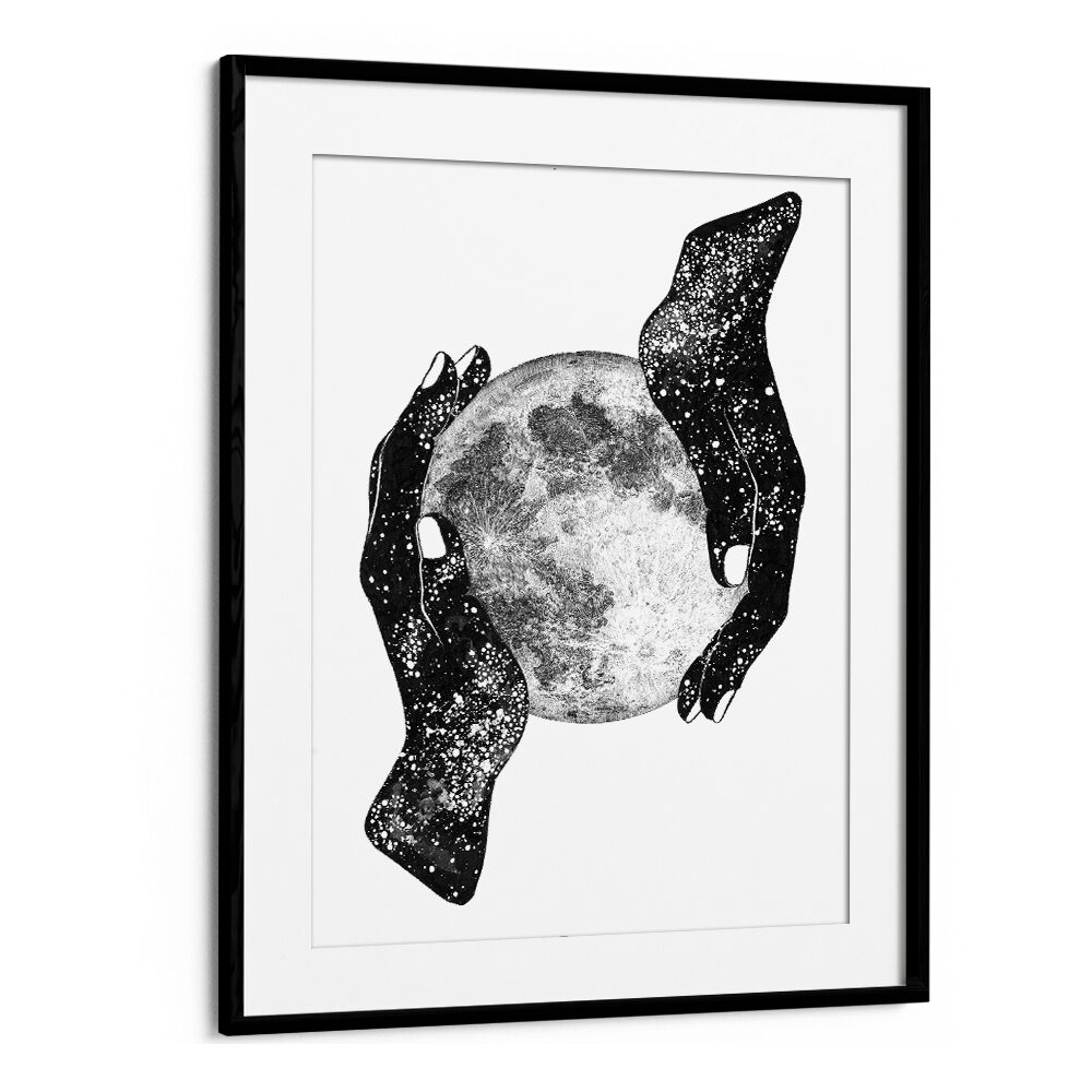 Captivating surreal art print, "THE MAGIC OF THE UNIVERSE," featuring hands cradling the moon in a sleek black frame.